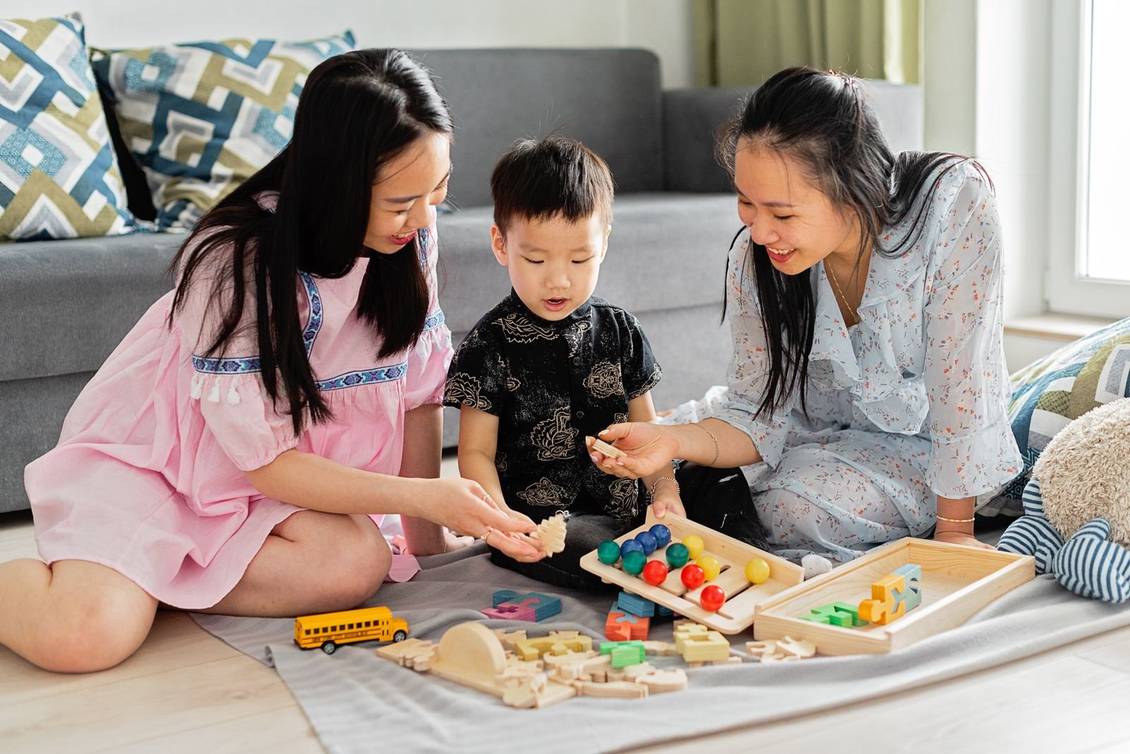 A parent and child learning through play in a warm home setting