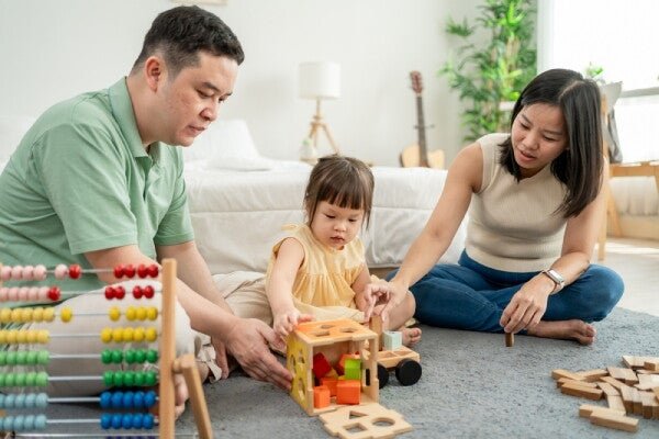 A family exploring educational toys together